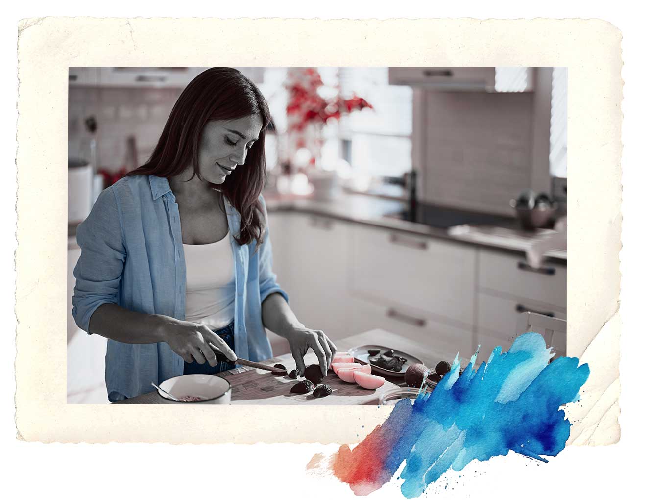 person cutting fruit