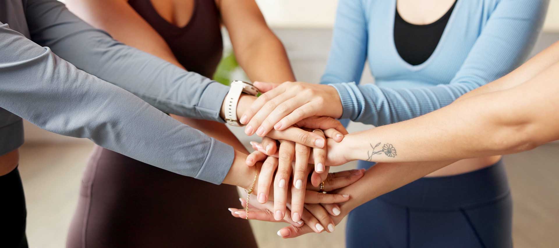 hands together in pilates group